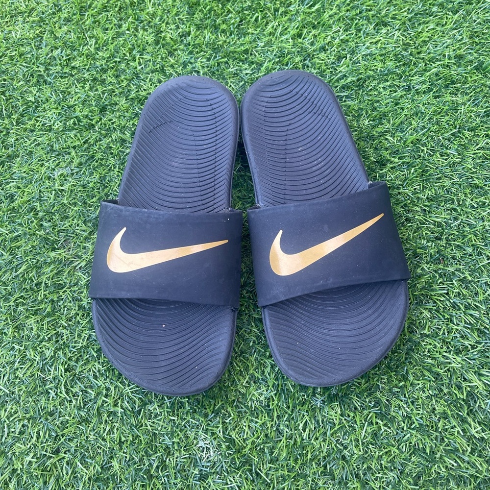 Nike Black Slide Sandals with Metallic Gold Logo
